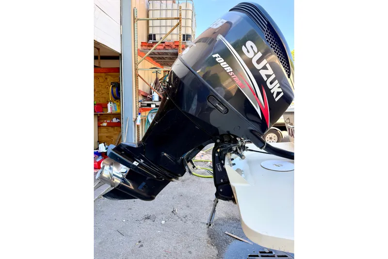 Slide: The Image of Suzuki Four Stroke outboard motor on 2007 NorthCoast 235 HT boat, dockside view. - 28