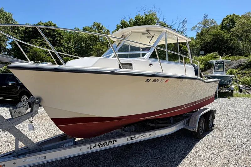 Slide: The Image of 2007 NorthCoast 235 HT boat on trailer, parked outdoors on gravel. - 3