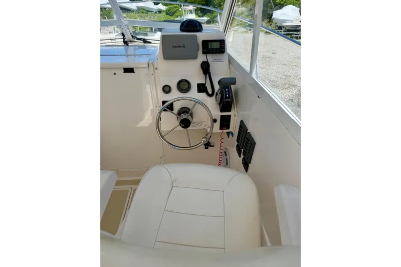 Slide: The Image of Helm of 2007 NorthCoast 235 HT boat with steering wheel and navigation equipment. - 8