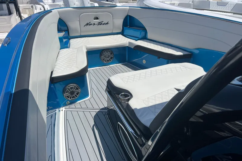 Slide: The Image of 2021 Nor-Tech 340 Sport Center Console with luxurious seating and modern design. - 12
