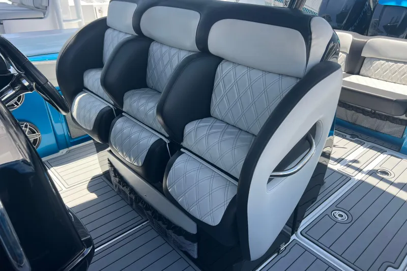 Slide: The Image of 2021 Nor-Tech 340 Sport Center Console with luxurious seating and modern interior design. - 14