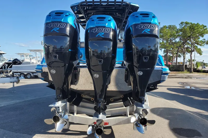 Slide: The Image of 2021 Nor-Tech 340 Sport Center Console with triple 400R outboard engines. - 4