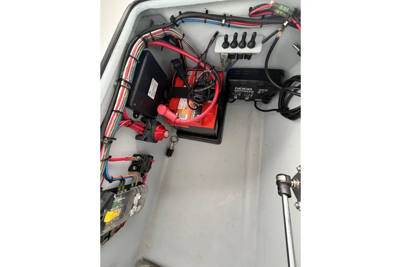 Slide: The Image of Electrical setup in a 1999 Hell's Bay boat, featuring wiring and battery components. - 7