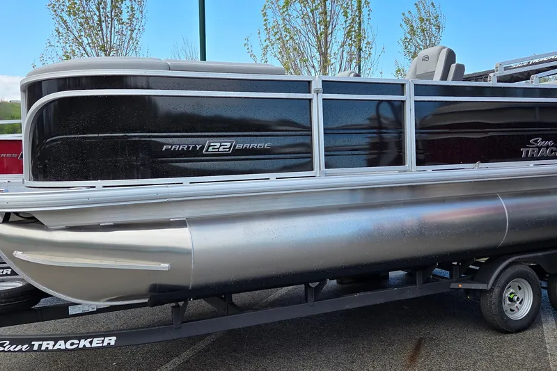 The Image of 2026 Sun Tracker Party Barge 22 RF DLX pontoon boat on trailer. - 0