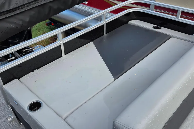Slide: The Image of 2026 Sun Tracker Party Barge 22 RF DLX pontoon boat seating area with cup holders. - 3
