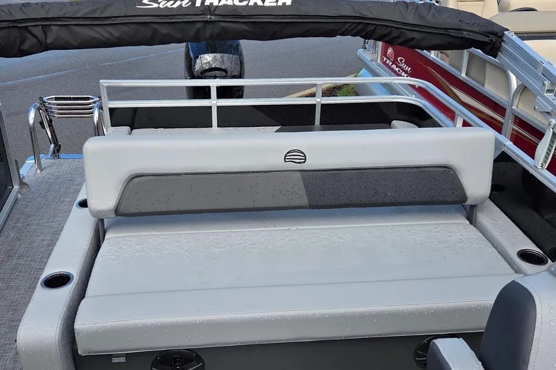 Slide: The Image of 2026 Sun Tracker Party Barge 22 RF DLX with gray seating and cup holders. - 4