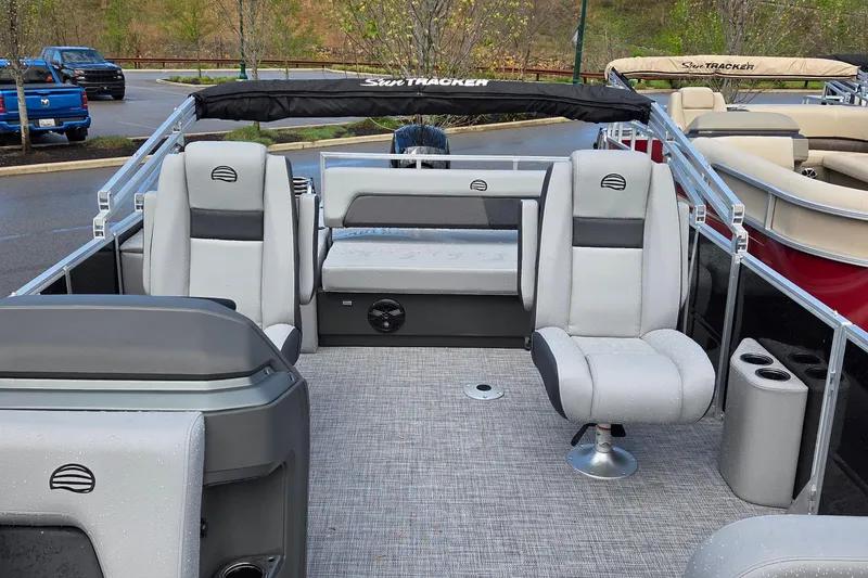Slide: The Image of 2026 Sun Tracker Party Barge 22 RF DLX interior with gray seating and modern design. - 5