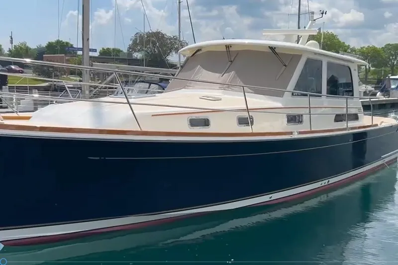 The Image of 2016 Sabre 42 Salon Express yacht docked in a marina. - 1
