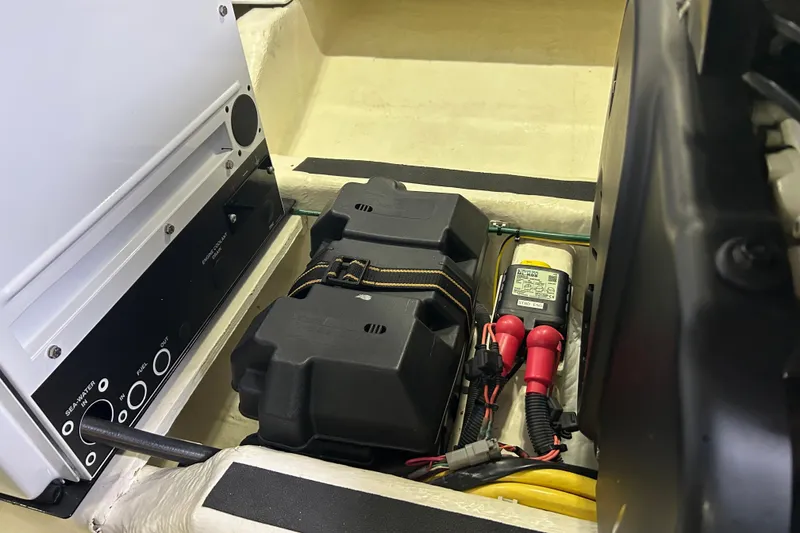 Slide: The Image of Engine compartment of a 2016 Sabre 42 Salon Express with battery and wiring components. - 14