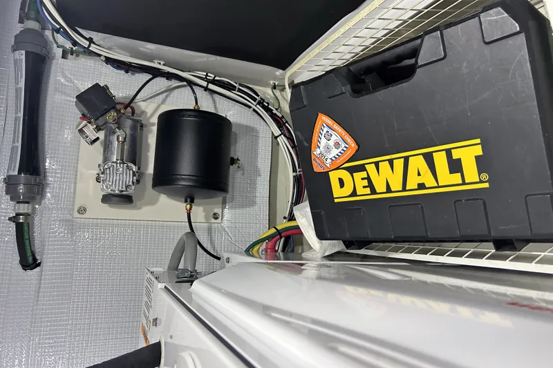 Slide: The Image of Electrical components and DeWalt toolbox inside 2016 Sabre 42 Salon Express yacht. - 17