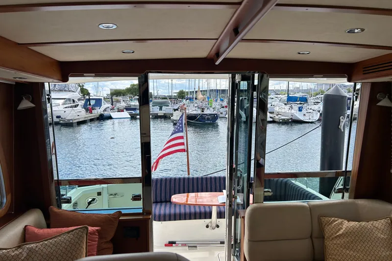 Slide: The Image of Interior view of 2016 Sabre 42 Salon Express yacht overlooking marina with boats. - 3