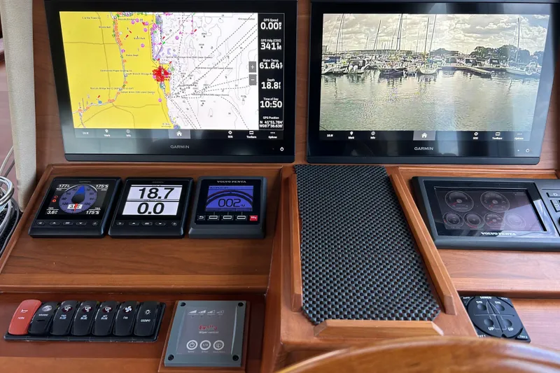 Slide: The Image of 2016 Sabre 42 Salon Express dashboard with navigation and control displays. - 5