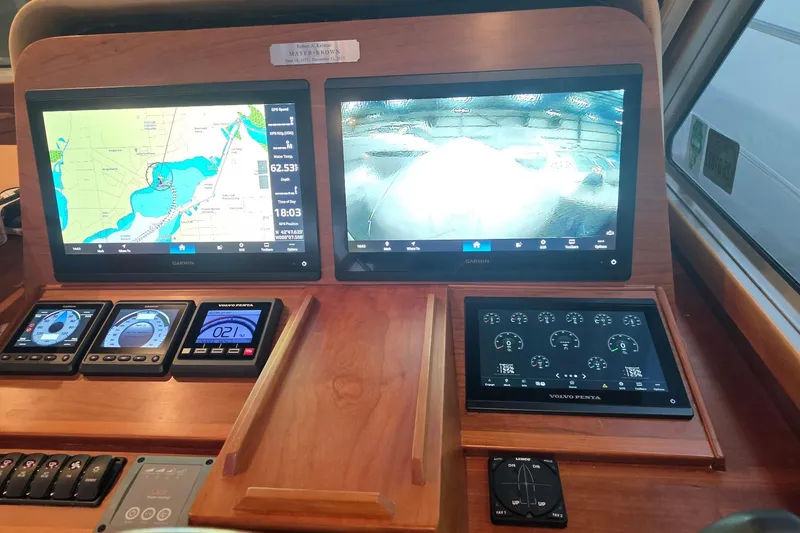 Slide: The Image of Dashboard of 2016 Sabre 42 Salon Express with navigation and control screens. - 6