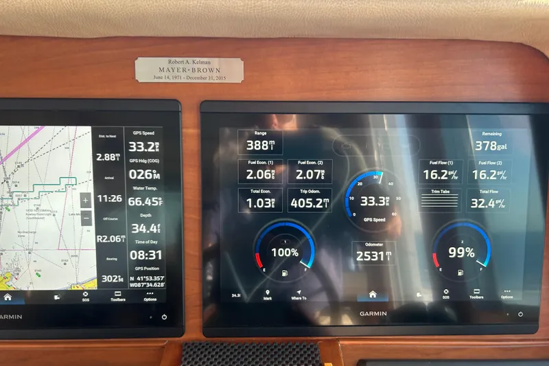Slide: The Image of Dashboard of a 2016 Sabre 42 Salon Express with navigation and fuel data displays. - 7