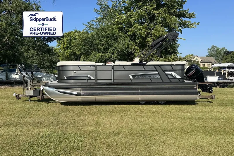 The Image of 2024 Starcraft EX 20 C pontoon boat on grass with trees in the background. - 0