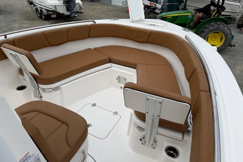 Slide: The Image of Interior of 2025 Robalo R232 Explorer with brown seating. - 11