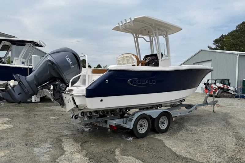 Slide: The Image of 2025 Robalo R232 Explorer boat on trailer, side view. - 18