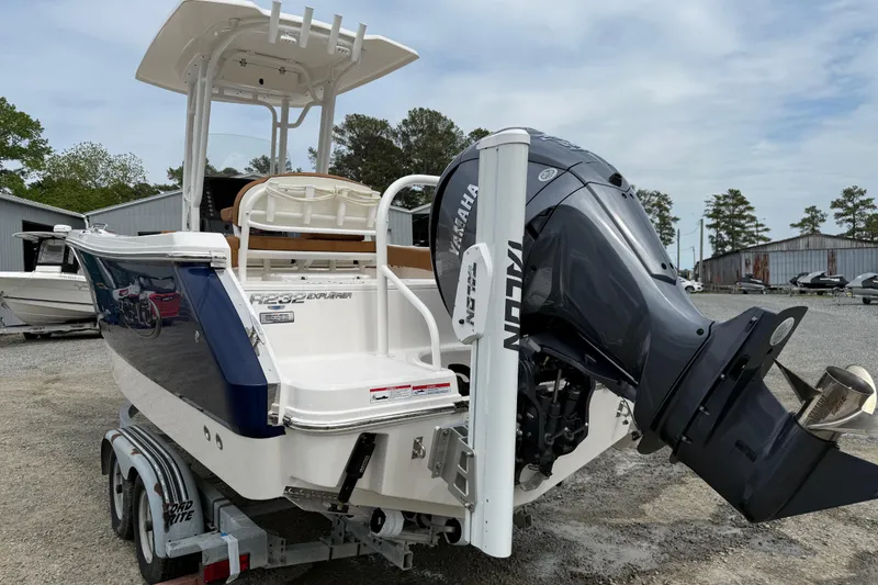 Slide: The Image of 2025 Robalo R232 Explorer boat with Yamaha outboard motor. - 2