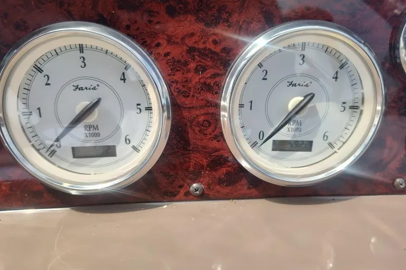 Slide: The Image of Close-up of RPM gauges on a 2006 Regal Commodore 3560 IO boat dashboard. - 15