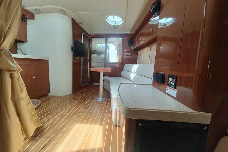 Slide: The Image of Luxurious interior of 2006 Regal Commodore 3560 IO yacht with wood finish and modern amenities. - 18