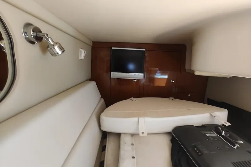 Slide: The Image of Interior of 2006 Regal Commodore 3560 IO yacht with TV and seating area. - 26