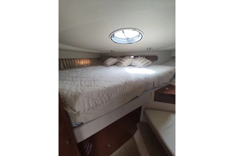 Slide: The Image of Interior cabin of 2006 Regal Commodore 3560 IO yacht with cozy bed and porthole. - 27