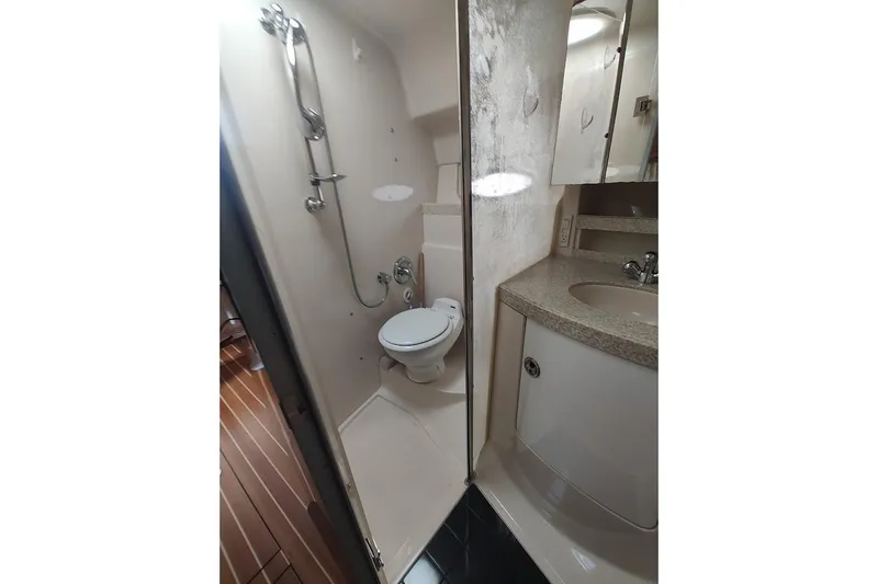 Slide: The Image of Bathroom interior of 2006 Regal Commodore 3560 IO yacht, featuring shower and sink. - 30