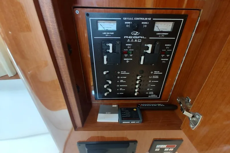Slide: The Image of Electrical control panel on a 2006 Regal Commodore 3560 IO boat. - 33