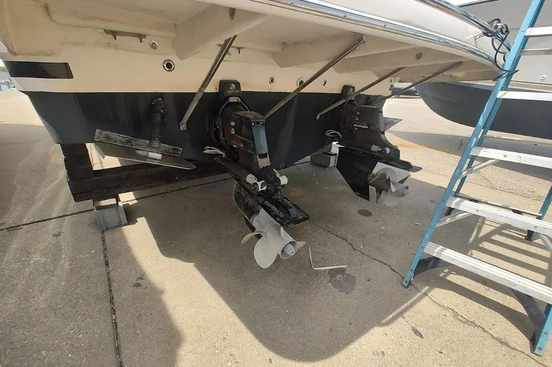 Slide: The Image of 2006 Regal Commodore 3560 IO boat stern with dual propellers on dry dock. - 4