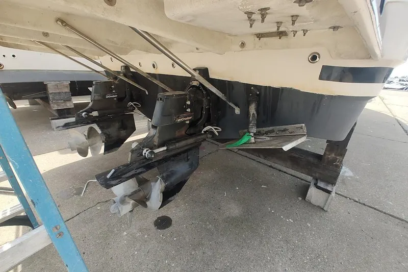 Slide: The Image of 2006 Regal Commodore 3560 IO boat stern with dual propellers on dry dock. - 5