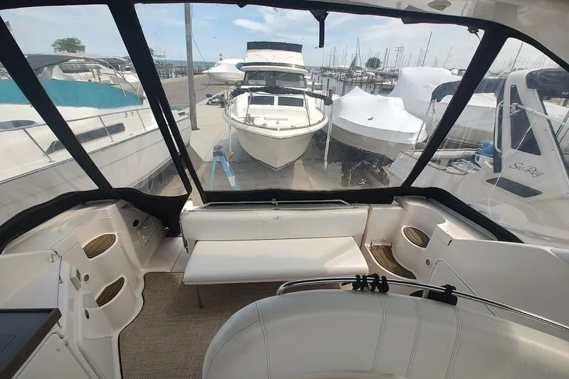 Slide: The Image of Interior view of a 2006 Regal Commodore 3560 IO yacht at a marina. - 9
