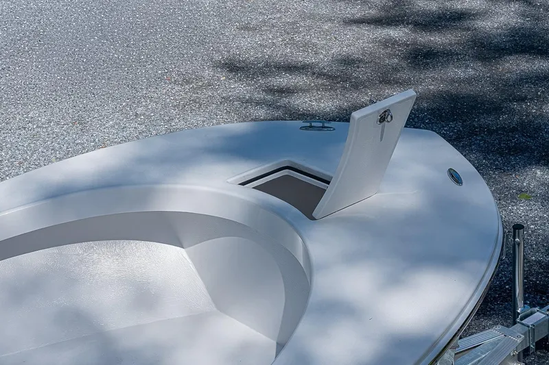 Slide: The Image of Bow of 2026 Privateer 2100 Roamer boat with open storage compartment. - 14