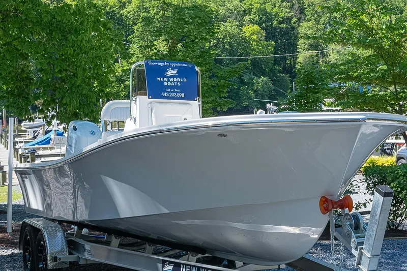 Slide: The Image of 2026 Privateer 2100 Roamer boat on trailer at New World Boats dealership. - 17
