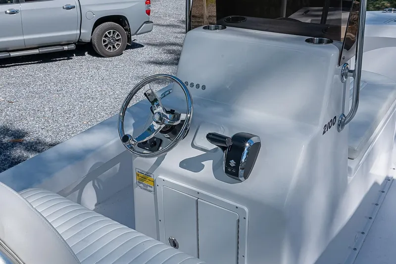 Slide: The Image of Privateer 2100 Roamer 2026 boat console with steering wheel and controls. - 5