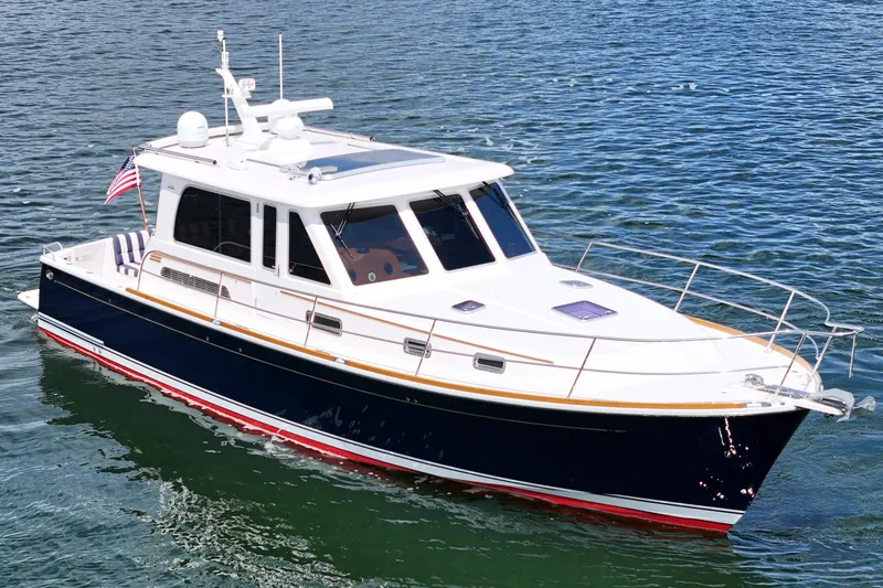 Slide: The Image of 2015 Sabre 42 Salon Express yacht cruising on calm blue waters. - 16