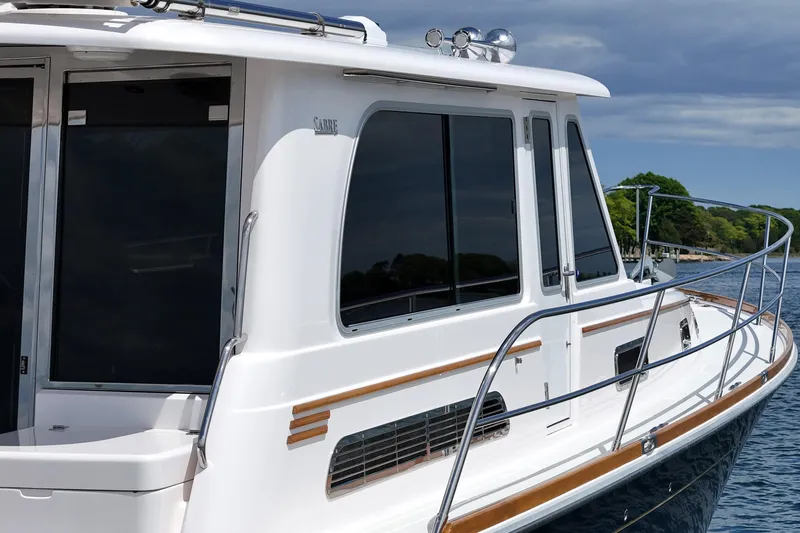 Slide: The Image of 2015 Sabre 42 Salon Express yacht with sleek design on calm water. - 19