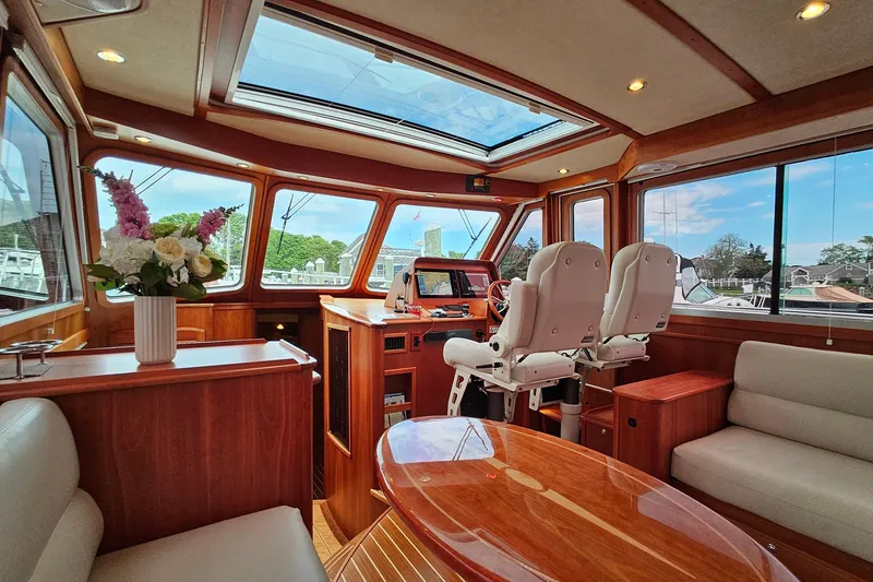 Slide: The Image of Luxurious interior of 2015 Sabre 42 Salon Express yacht with elegant wood finish and seating. - 25