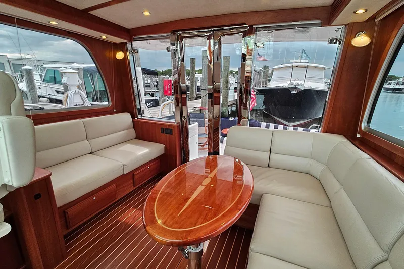 Slide: The Image of Interior of 2015 Sabre 42 Salon Express yacht with elegant seating and wooden table. - 27