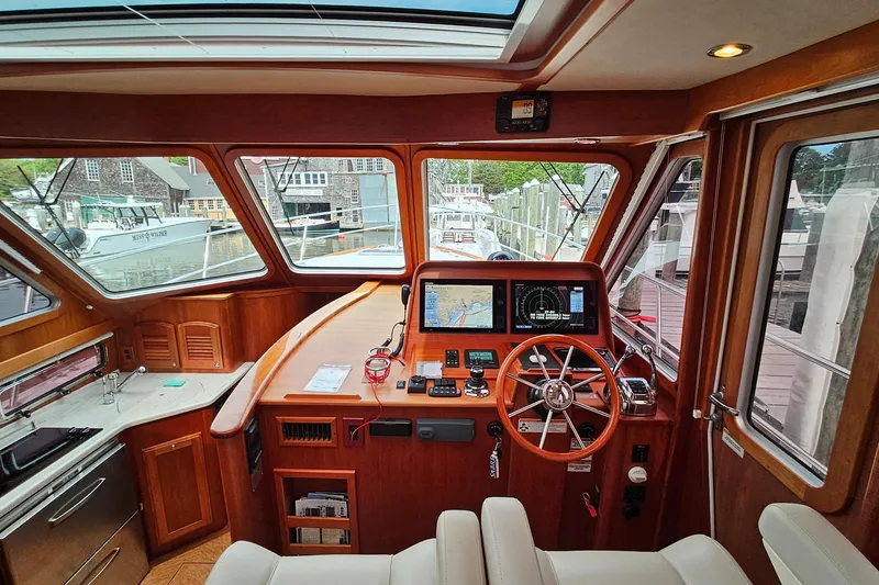 Slide: The Image of Interior view of a 2015 Sabre 42 Salon Express yacht cockpit with navigation equipment. - 28