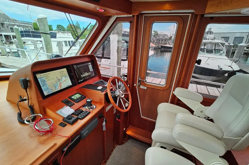 Slide: The Image of Interior of 2015 Sabre 42 Salon Express yacht with navigation equipment and luxurious seating. - 29