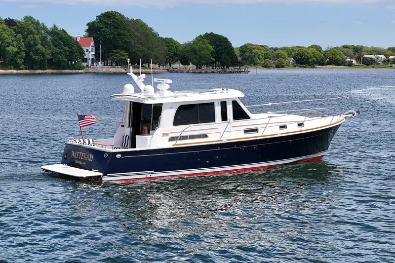 Slide: The Image of 2015 Sabre 42 Salon Express yacht cruising on a scenic waterway. - 3