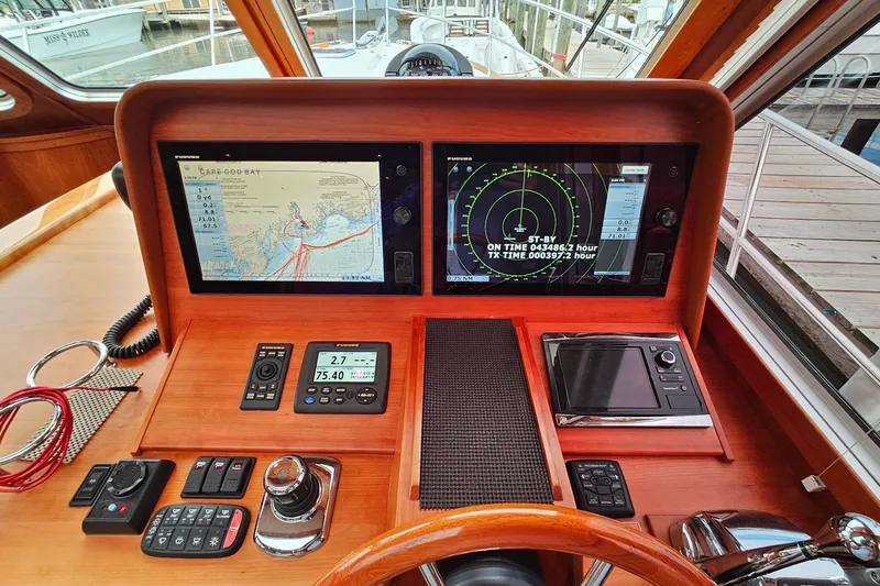 Slide: The Image of Control panel of a 2015 Sabre 42 Salon Express yacht with navigation screens. - 31
