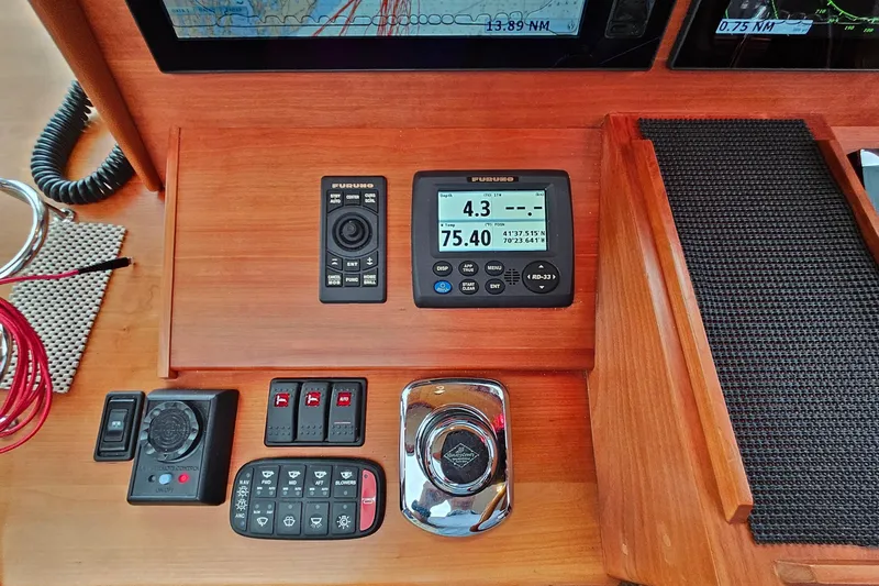 Slide: The Image of Control panel of a 2015 Sabre 42 Salon Express with navigation and monitoring instruments. - 32