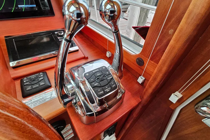 Slide: The Image of Control panel of a 2015 Sabre 42 Salon Express yacht with polished levers and buttons. - 34