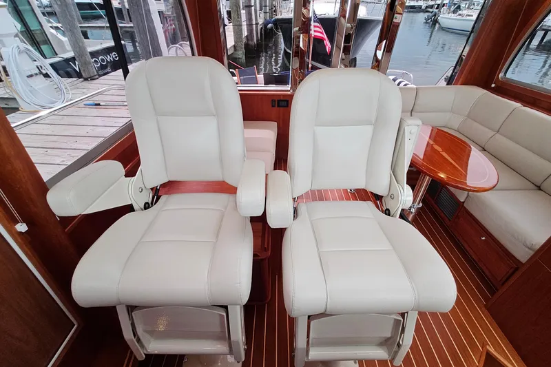 Slide: The Image of Interior of 2015 Sabre 42 Salon Express with plush seating and wooden accents. - 37