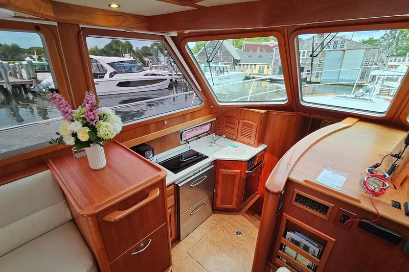 Slide: The Image of Interior of 2015 Sabre 42 Salon Express yacht with elegant wood finish and waterfront view. - 39
