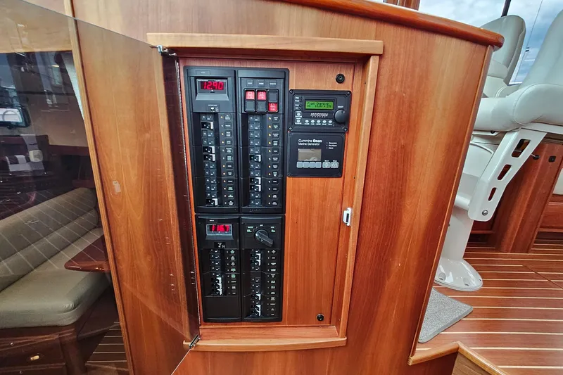 Slide: The Image of Electrical panel inside 2015 Sabre 42 Salon Express yacht, featuring control switches and displays. - 40