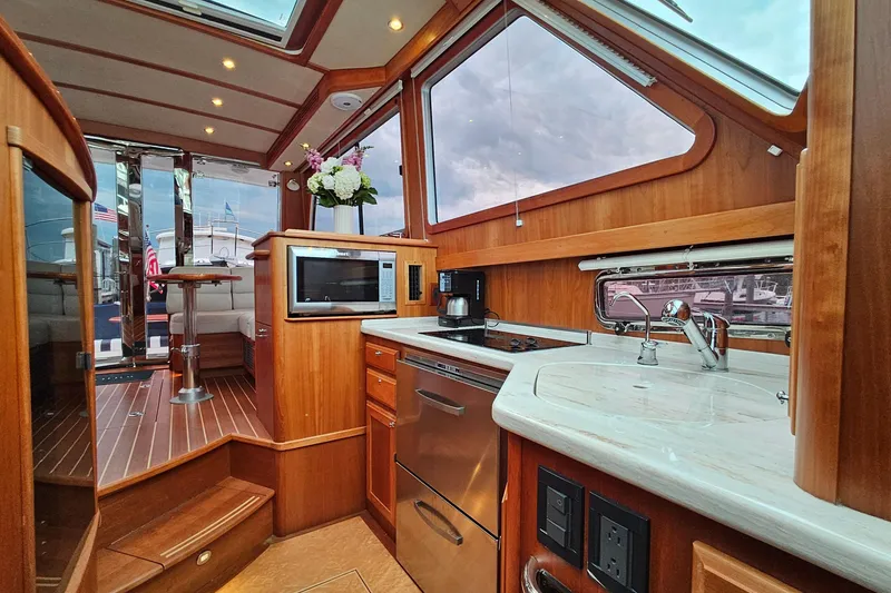 Slide: The Image of Luxurious interior of 2015 Sabre 42 Salon Express yacht with modern kitchen amenities. - 44