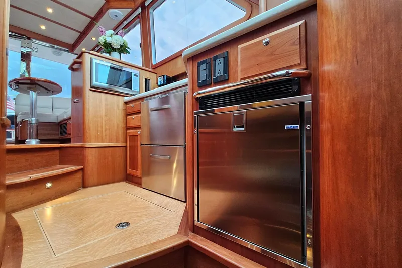 Slide: The Image of Luxurious interior of 2015 Sabre 42 Salon Express yacht with modern kitchen amenities. - 45