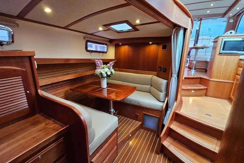 Slide: The Image of Luxurious interior of 2015 Sabre 42 Salon Express yacht with elegant wood finish and cozy seating. - 48